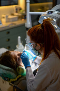 dental website design - photo of a dentist working with a patient